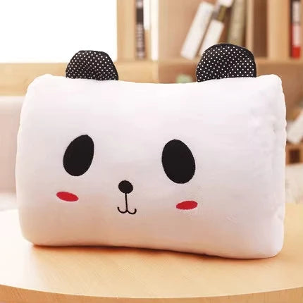 Cute white kawaii pillow with black eyes and red cheeks on a wooden surface.