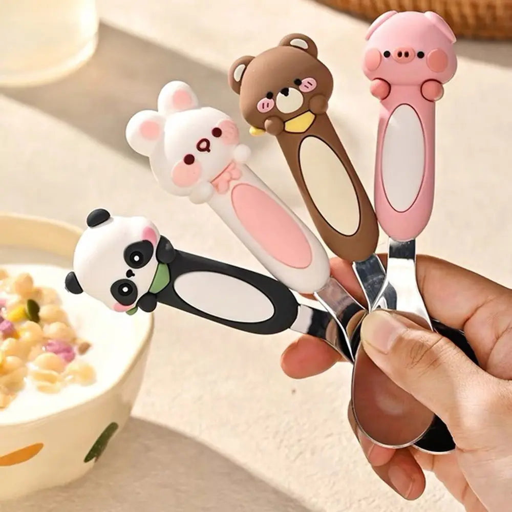 Someone holding up a group of four kawaii spoons