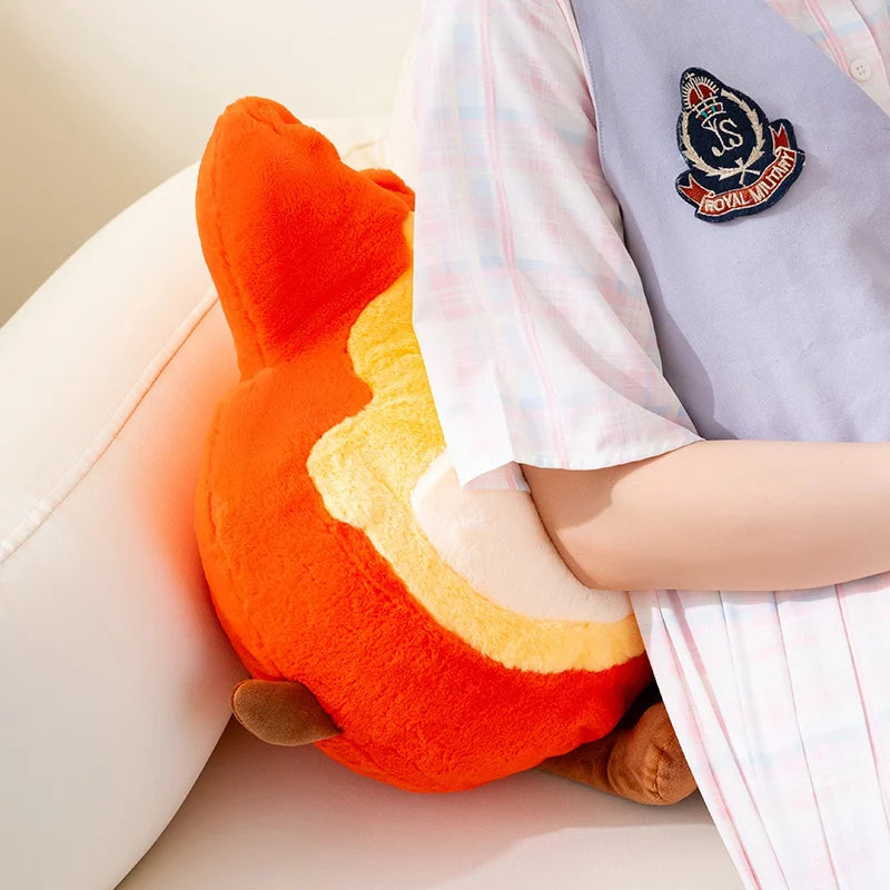 Person holding a colorful kawaii plush toy resembling a fish on a light background