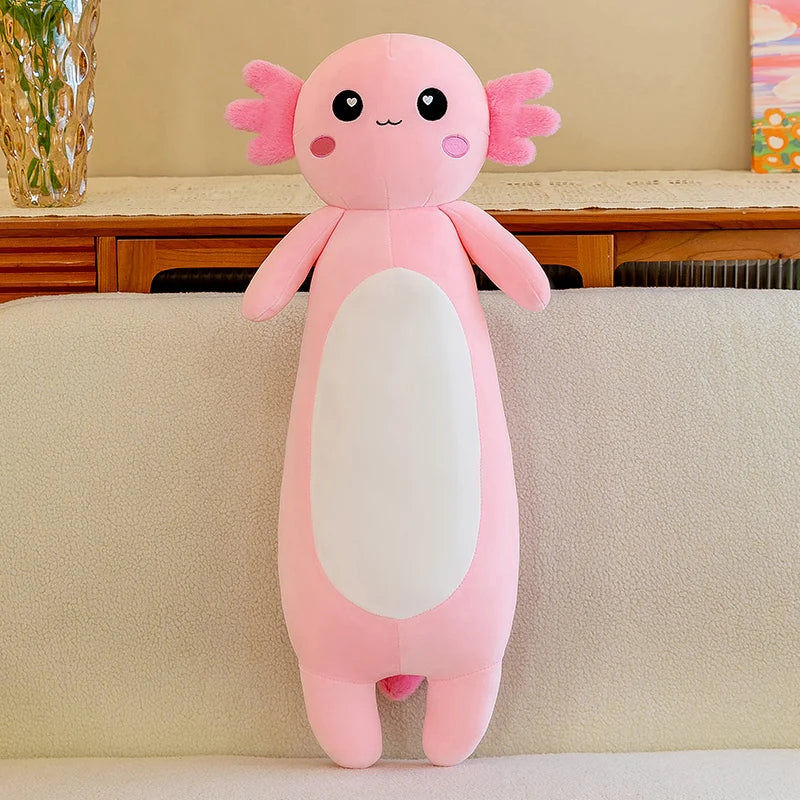 Pink axolotl kawaii plush toy on a beige couch