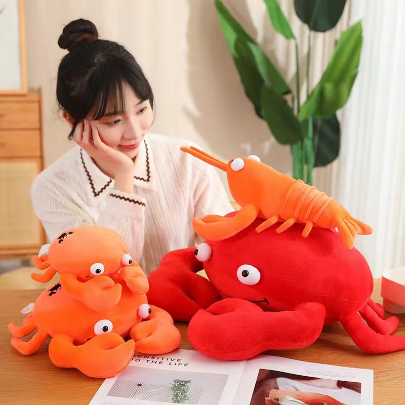 Person sitting at a table with kawaii plush octopus and lobster toys.