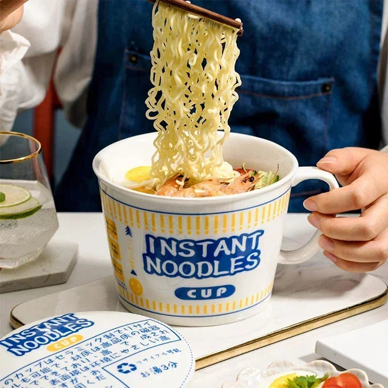 Someone eating noodles from a kawaii ramen bowl