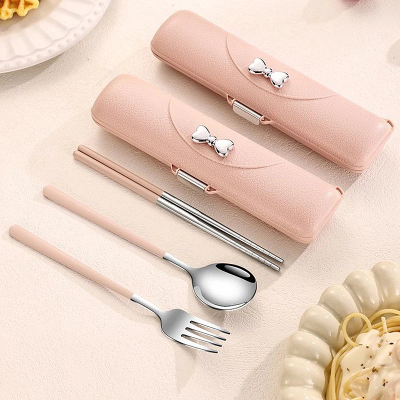 Pink kawaii utensils set with cases on a light surface