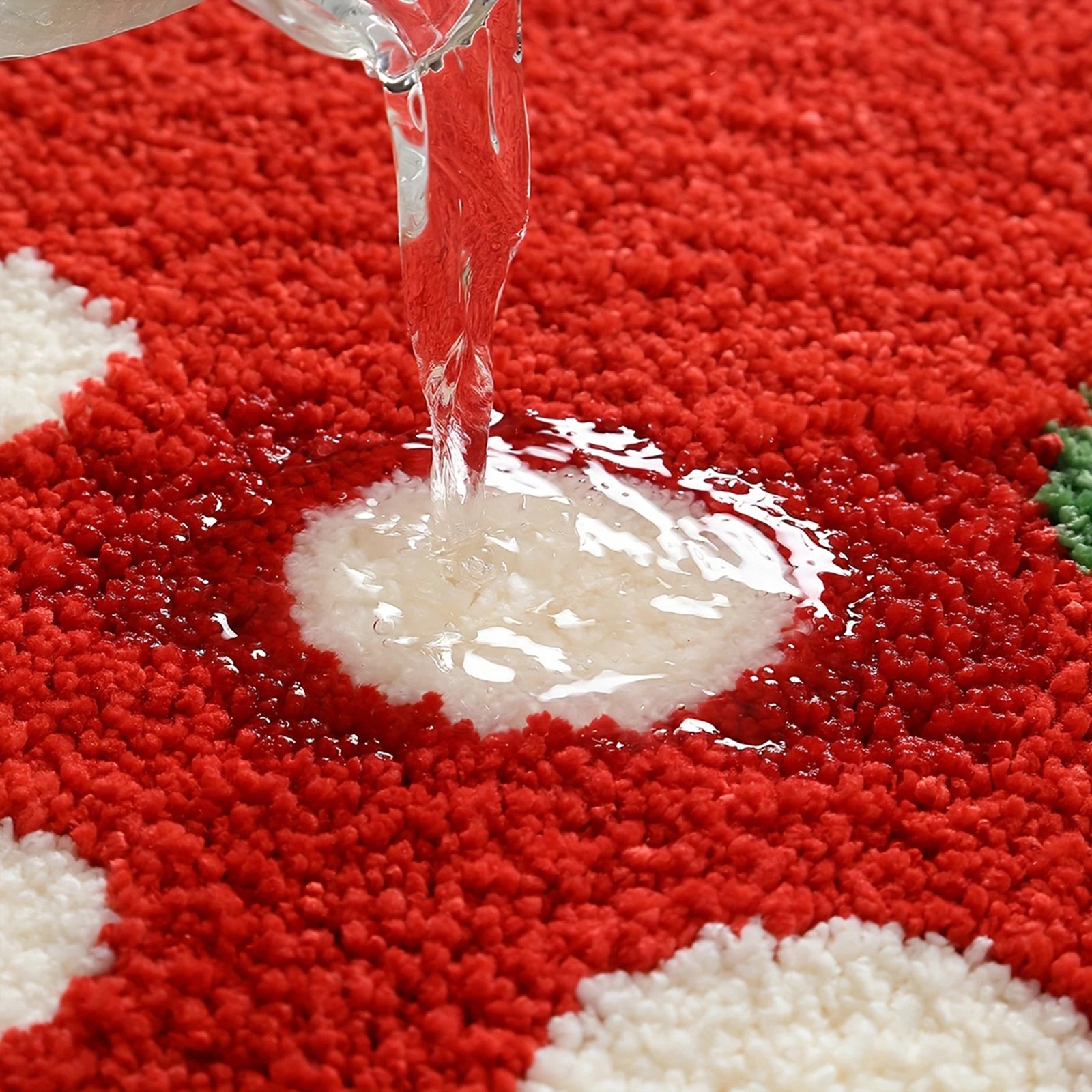 Water being poured onto a red and white checkered kawaii rug