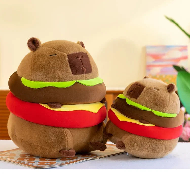 Two kawaii plush toys shaped like hamburgers on a table with a colorful background