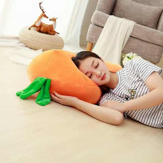 Woman lying on a couch with a large carrot-shaped kawaii pillow