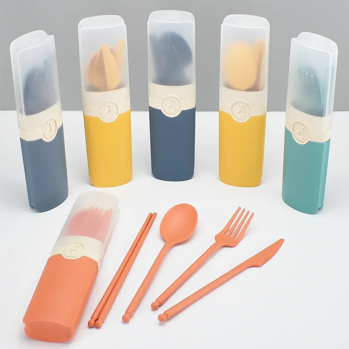 A group of kawaii utensils in different colors on a table