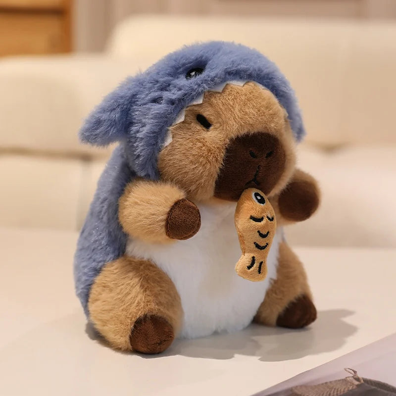 Kawaii plush toy resembling a character with a blue hat and brown body on a light background