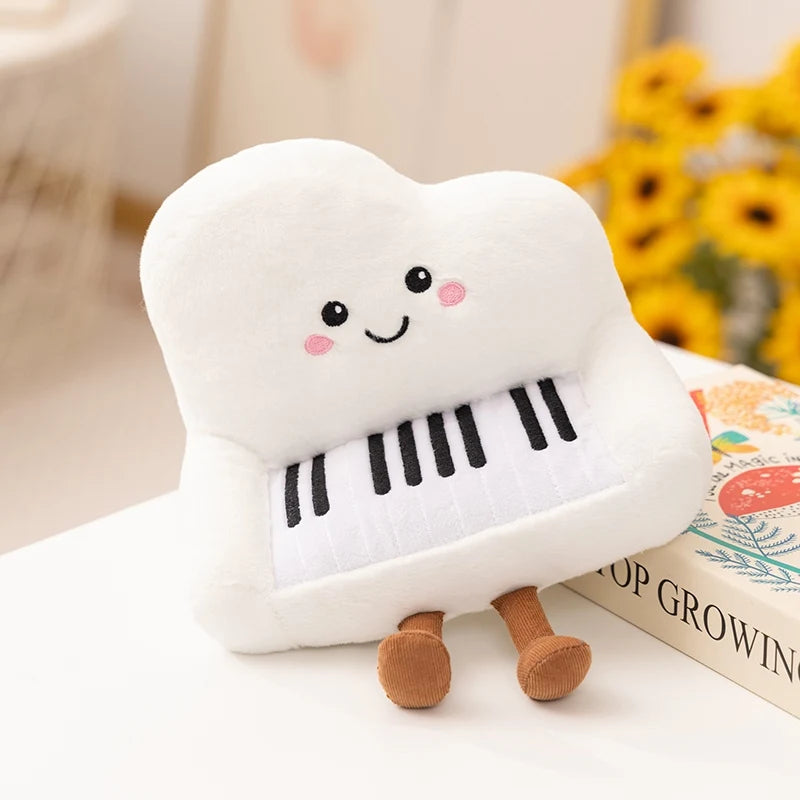 Kawaii plush toy shaped like a piano with a smiling face on a surface with a blurred background