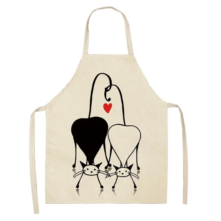 Beige apron with black and white cat Kawaii illustration and red heart on a white background