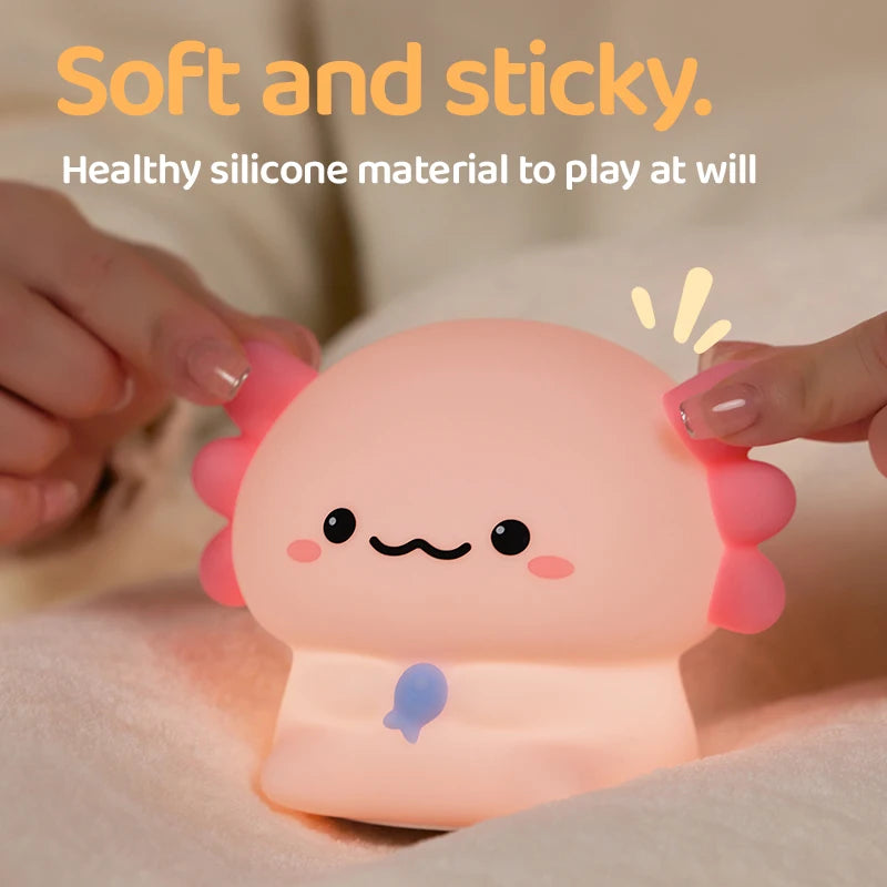 Kawaii axolotl night light being held