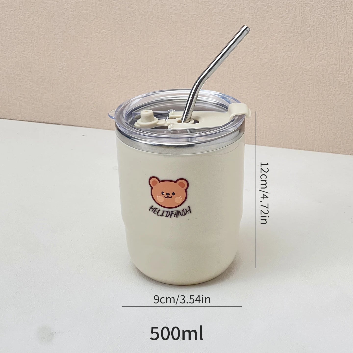 White kawaii tumbler with bear design and straw on a beige background