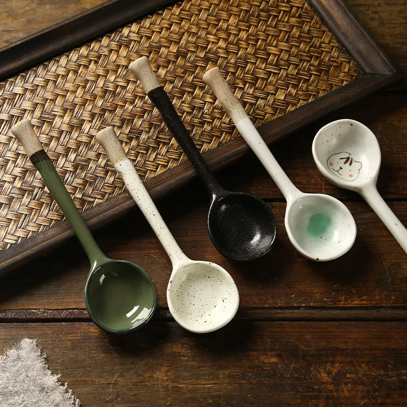 Five kawaii spoons of different styles sitting on the kitchen table