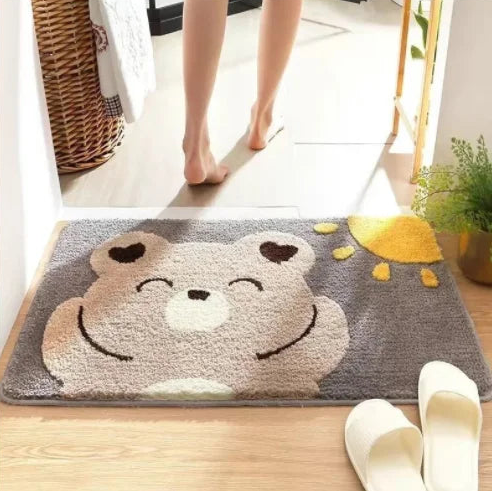 Cute Kawaii bear face rug on a wooden floor with a person stepping onto it.