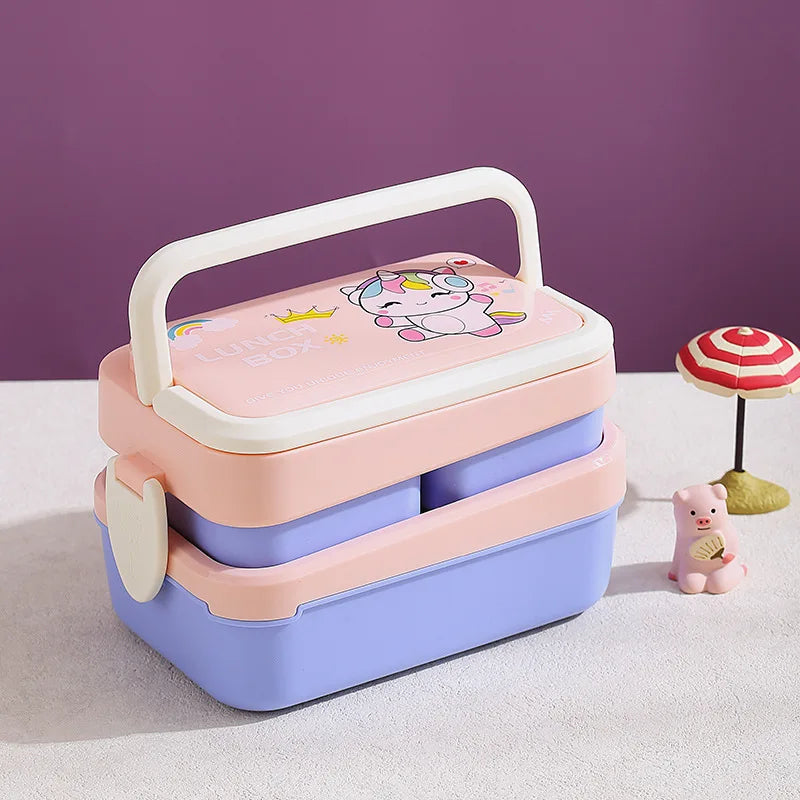 Stackable pink and purple kawaii lunch boxes with a unicorn design on a light purple background