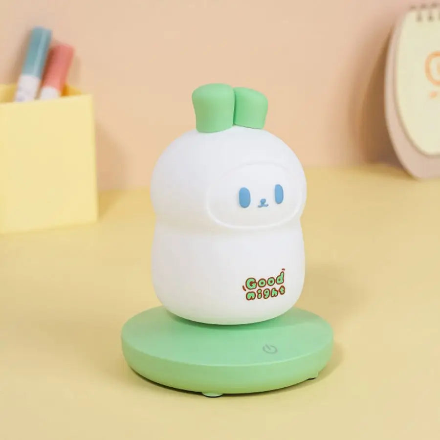 Cute kawaii white and green night light with 'Good Night' text on a yellow background