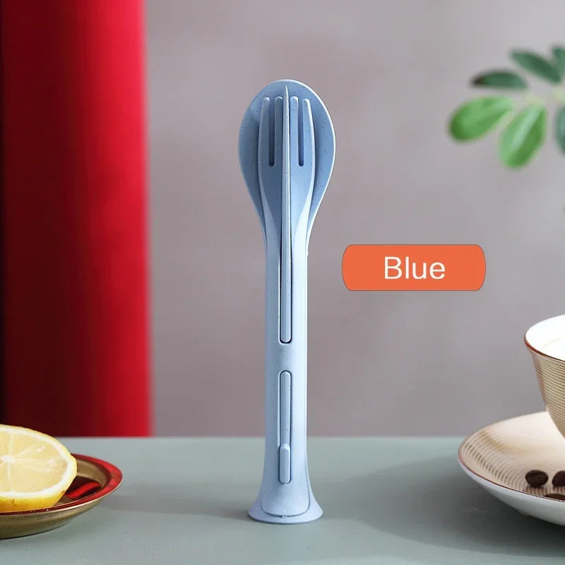 Blue kitchen kawaii utensils on a table with a lemon and plant in the background
