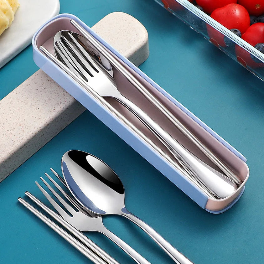 Stainless steel kawaii utensils set with a blue case on a blue surface.