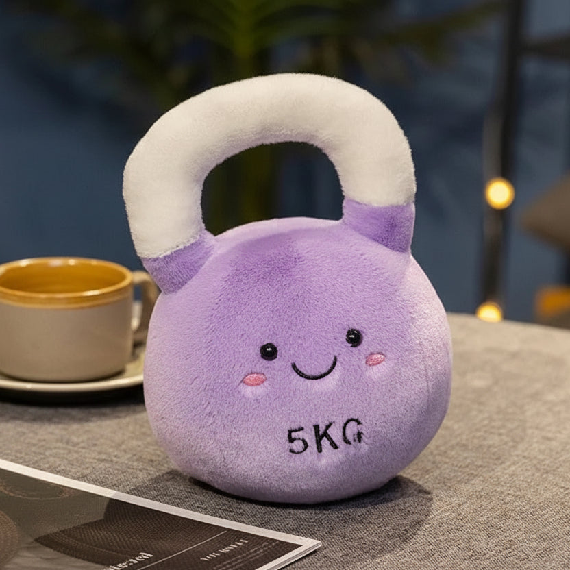 Kawaii plush purple kettlebell with a smiley face on a table next to a cup.
