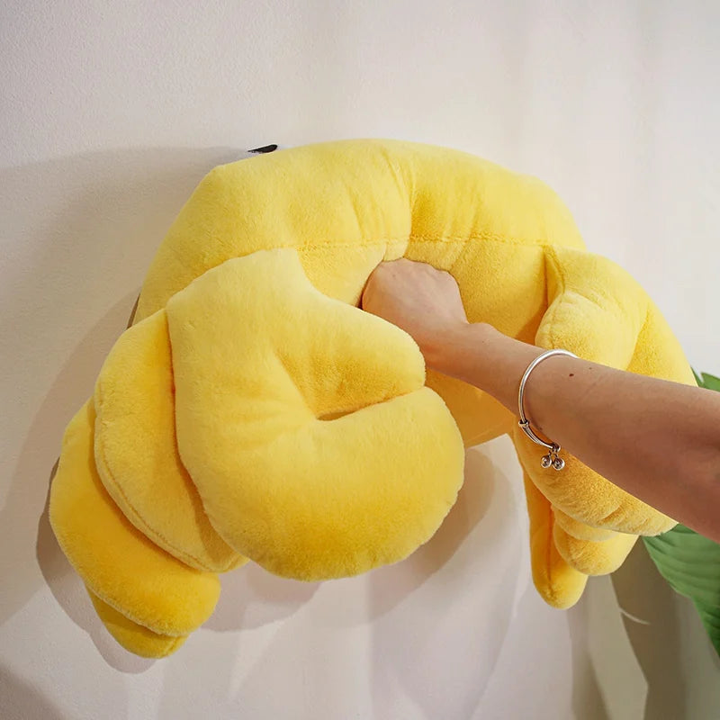 Yellow neck kawaii pillow held by a person against a white background