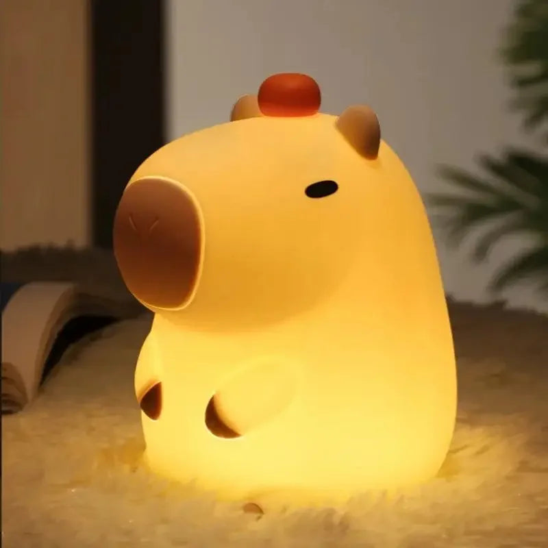 Cute animal-shaped kawaii night light on a soft surface with a blurred background