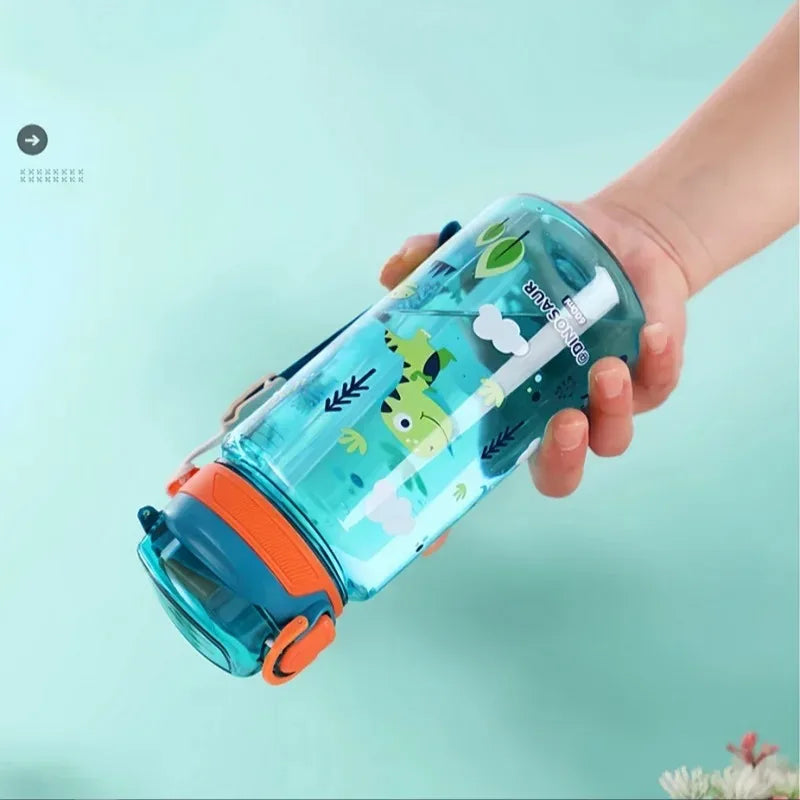 Child's hand holding a colorful kawaii water bottle with cartoon designs on a light blue background