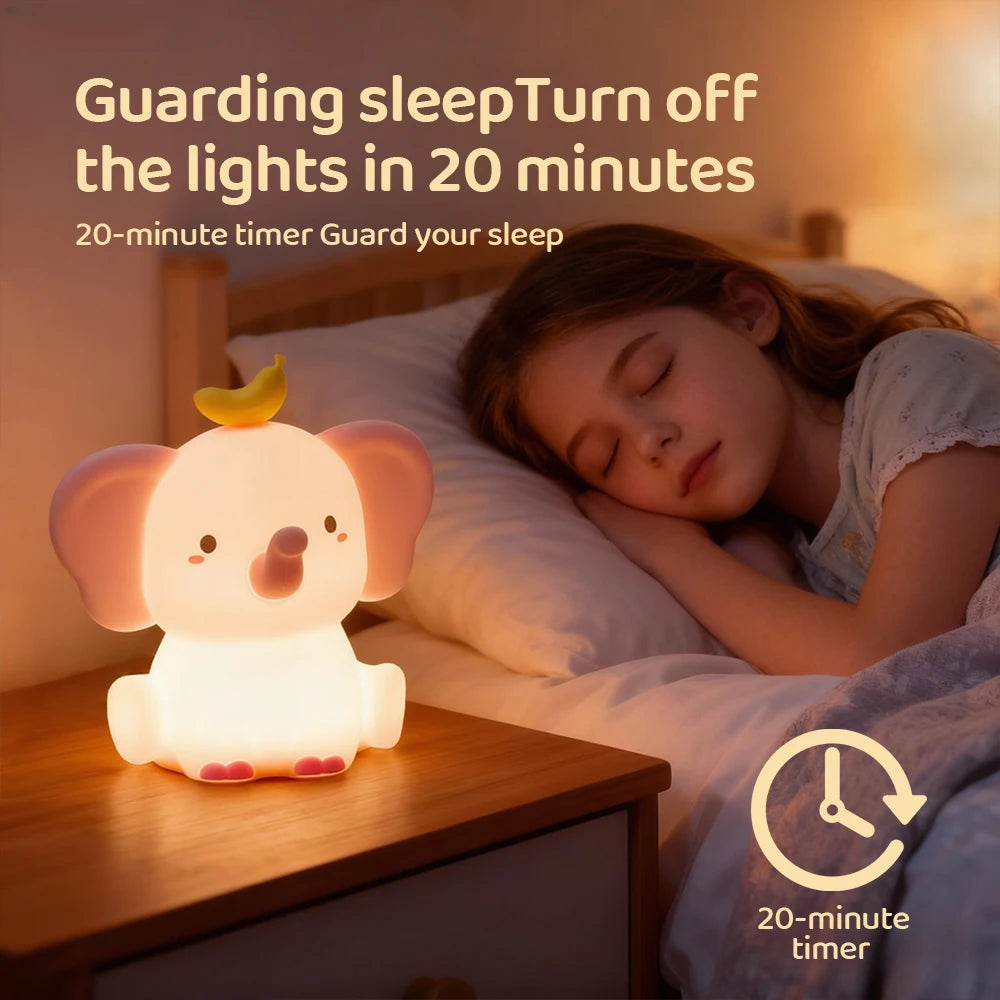 Child sleeping in bed with a glowing elephant-shaped kawaii night light on a nightstand.