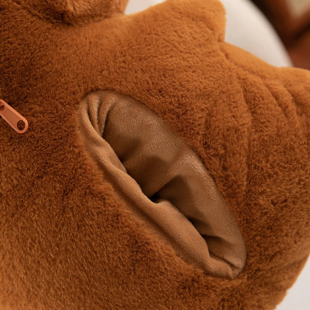 Close-up of a brown kawaii plush toy with a pocket