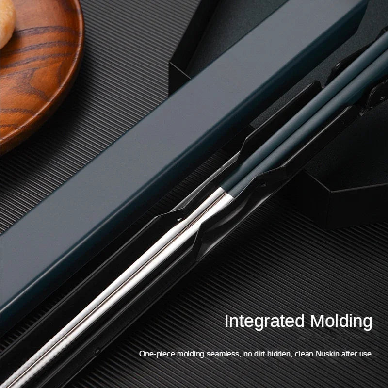 Close-up of kawaii chopsticks with integrated molding on a textured surface.
