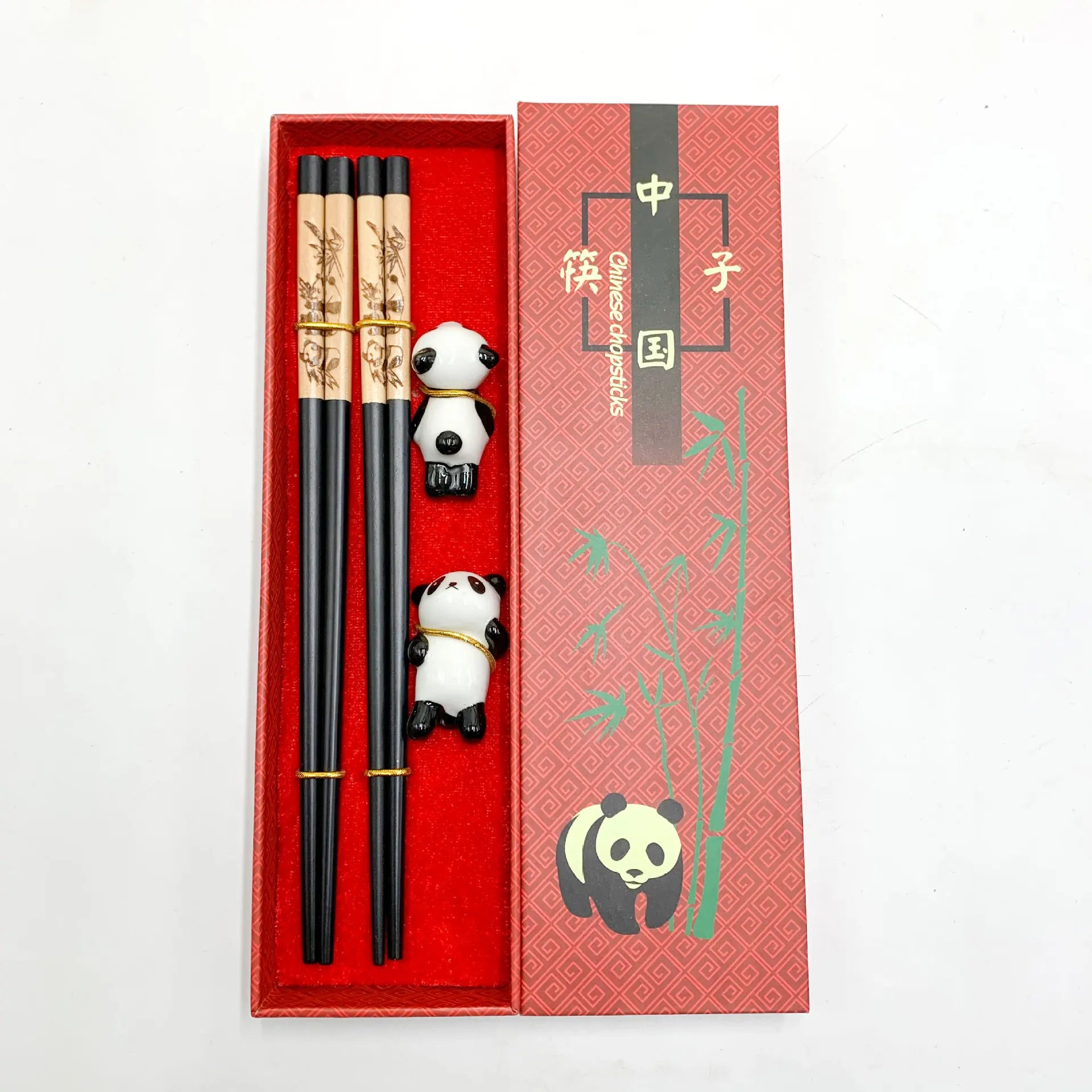 Panda-themed kawaii chopsticks set with panda decorations in a red box on a white background