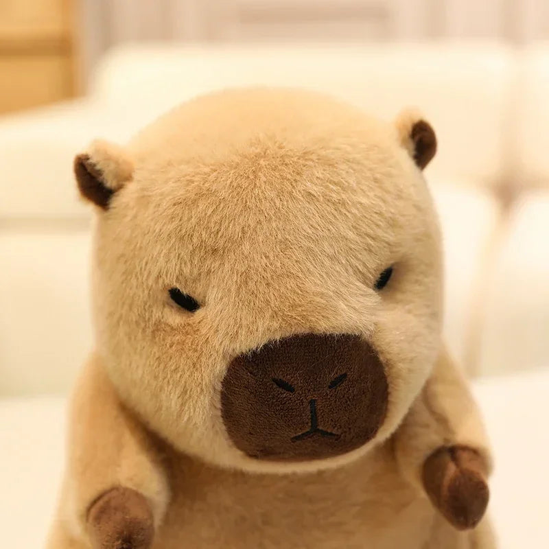 Kawaii plush toy resembling a bear with a sad expression on a blurred background
