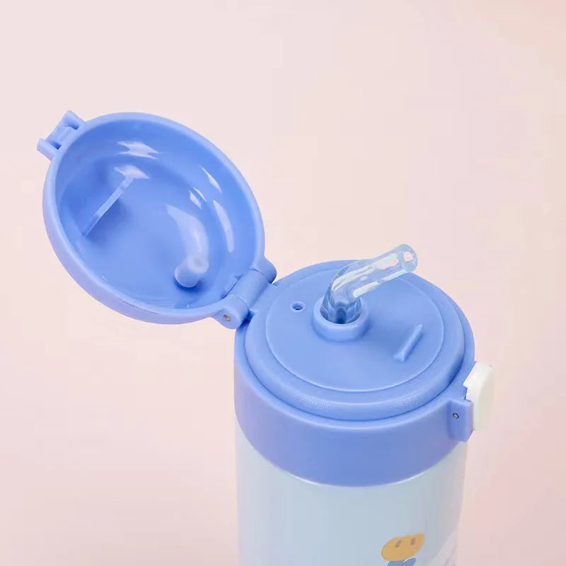 Blue children's kawaii tumbler with a straw on a light pink background