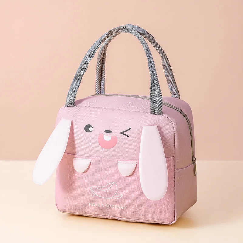 Pink kawaii lunch bag with bunny design on a beige background