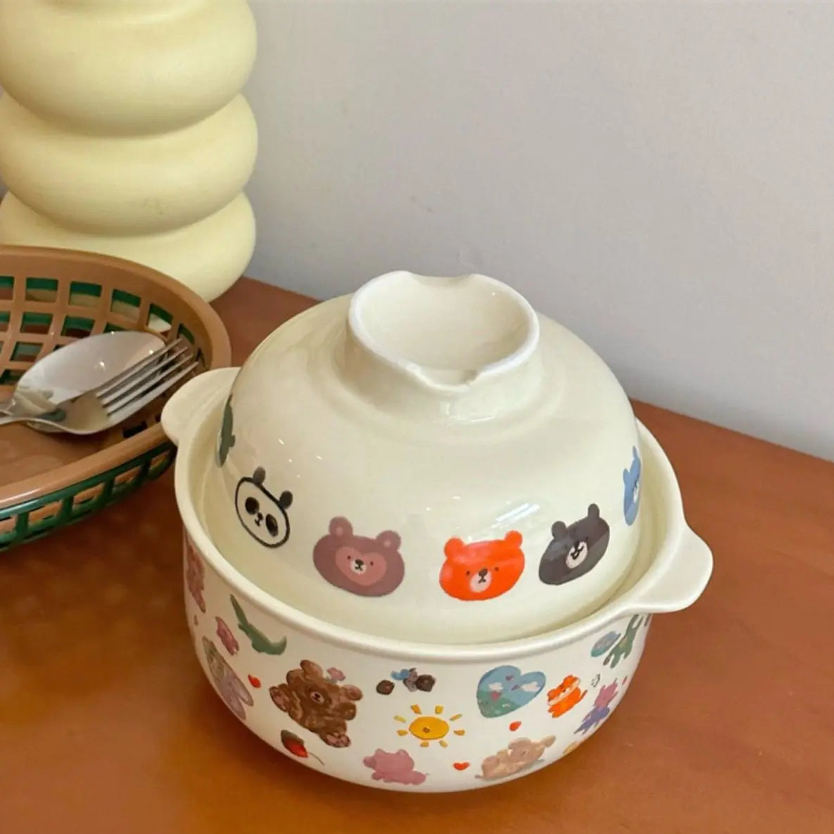 A white kawaii bowl with cartoons designed on it