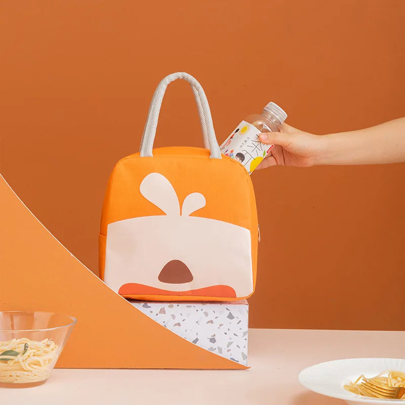 Orange kawaii lunch bag with cartoon design on a brown background