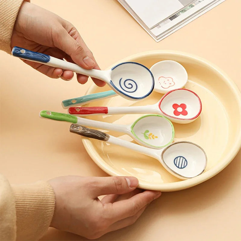 A person holding a set of kawaii spoons