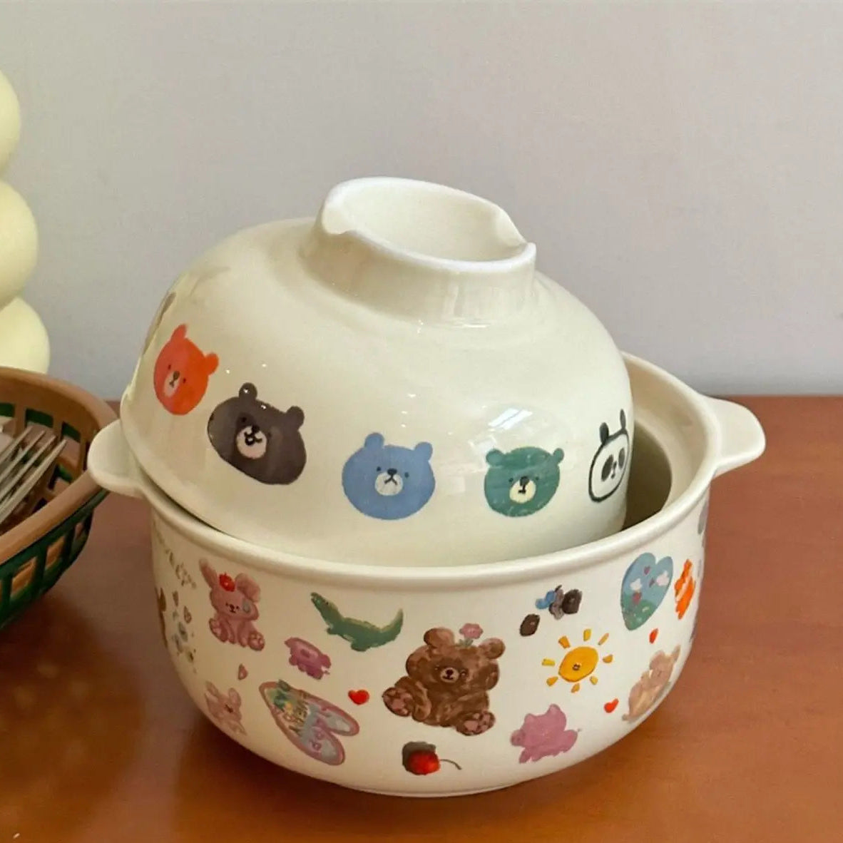 A white kawaii bowl with cartoons designs on it