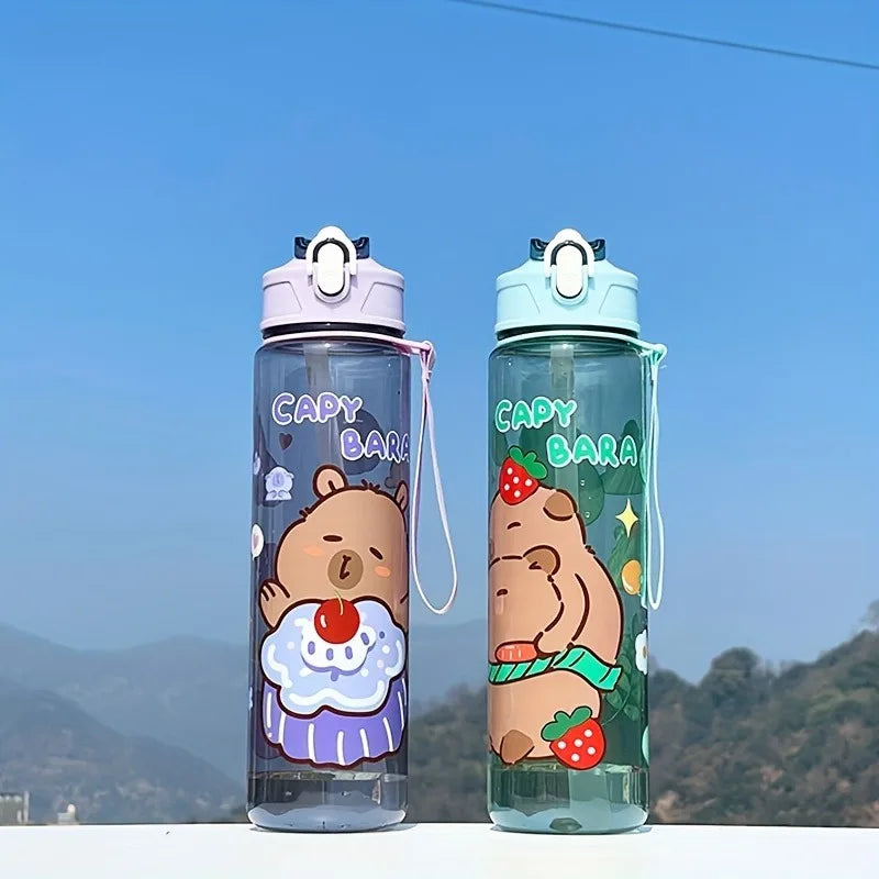 Two kawaii-themed water bottles with 'Capybara' design against a mountainous background.