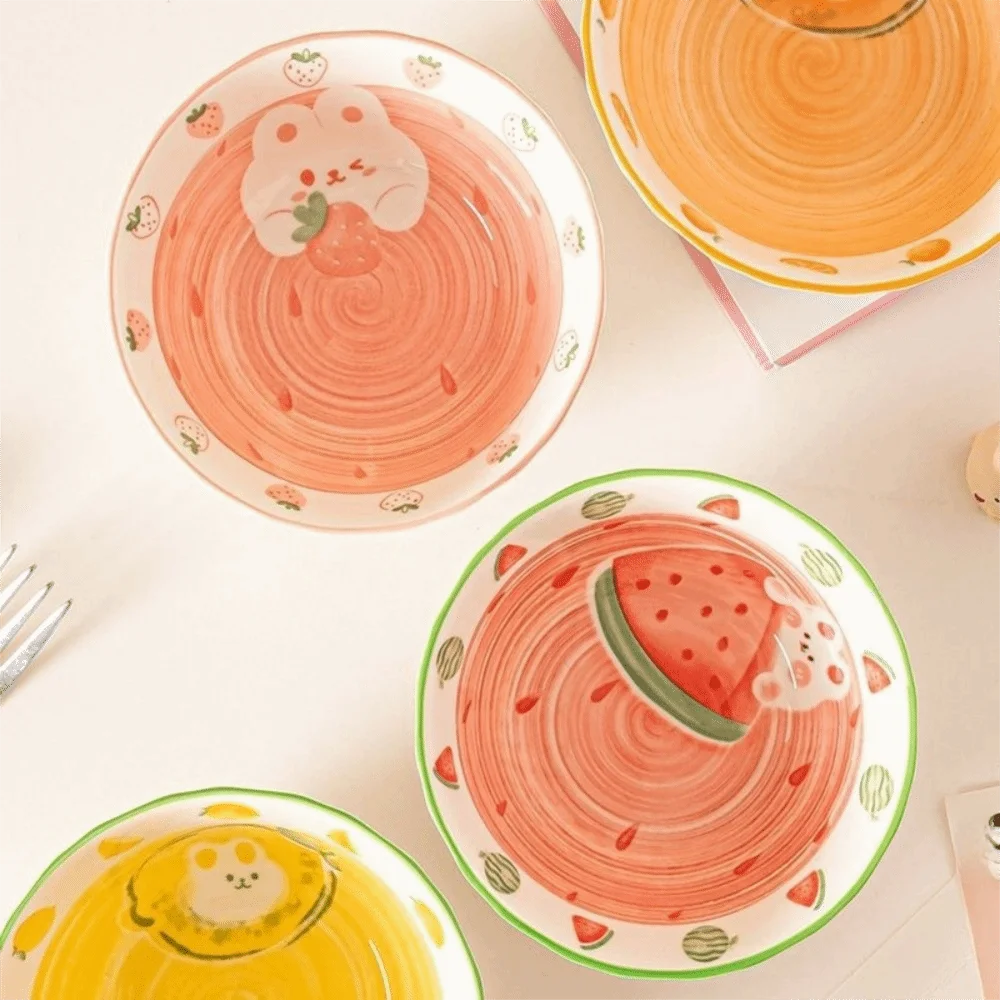 Set of colorful children's kawaii ramen bowls with animal and fruit designs on a light background.