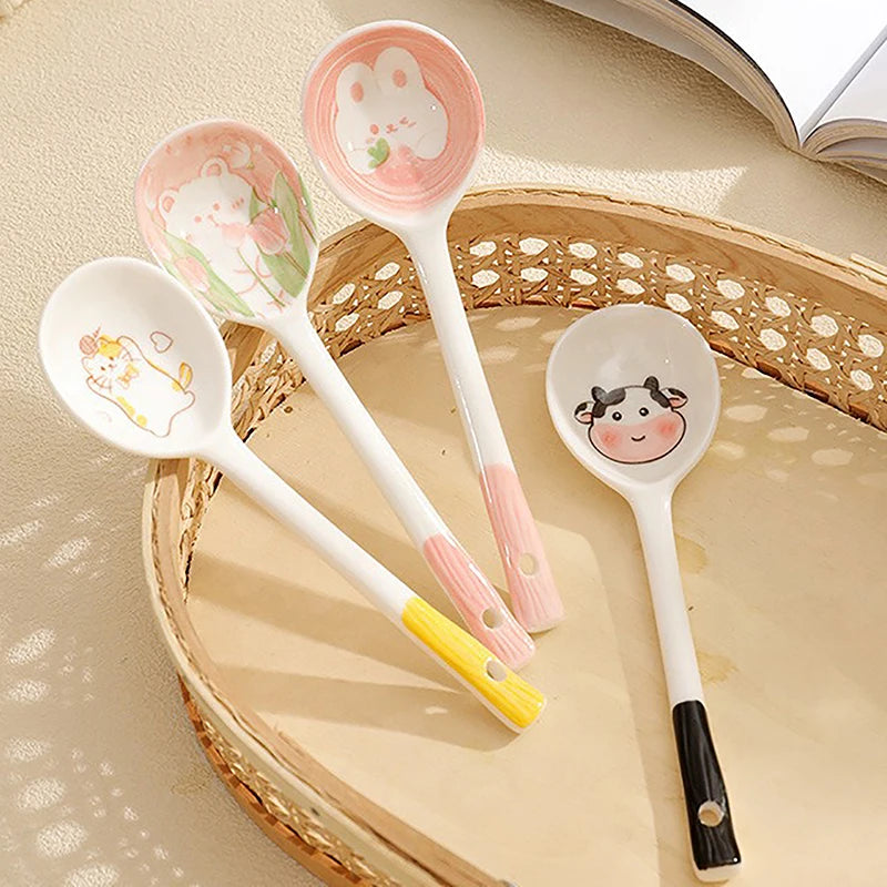 A group of four kawaii spoons on a tray