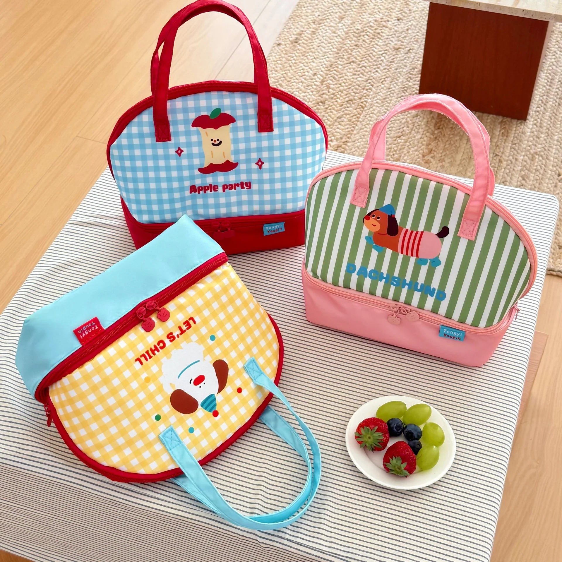 Four colorful children's kawaii bags with cartoon designs on a table.