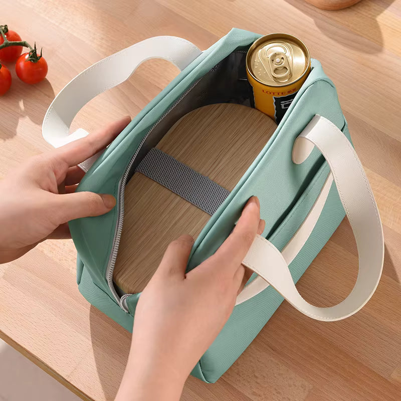 Green cooler bag with a can of beer on a wooden surface