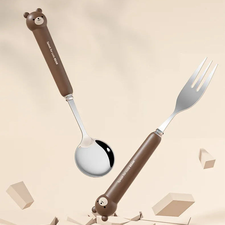 Kawaii utensils with cartoon bear handles on a beige background