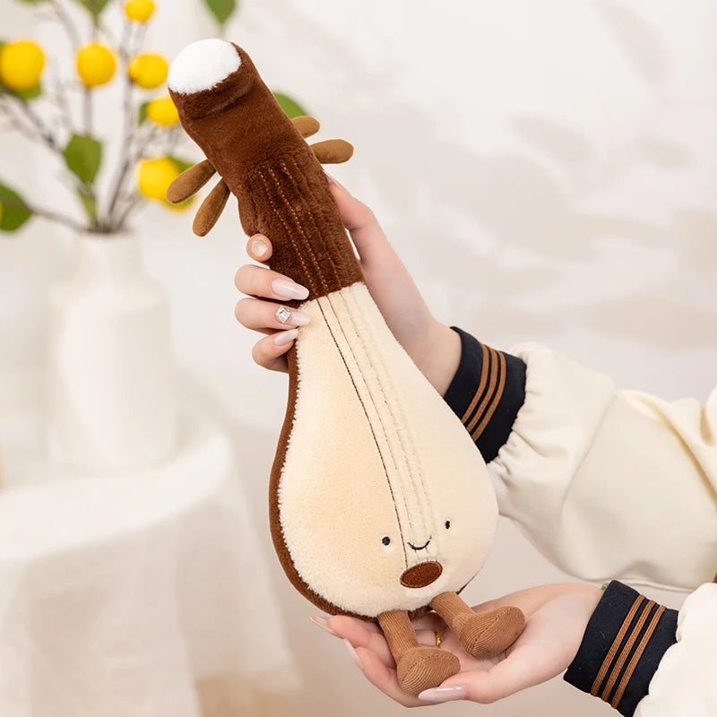Person holding a kawaii plush toy resembling a musical instrument with a deer head