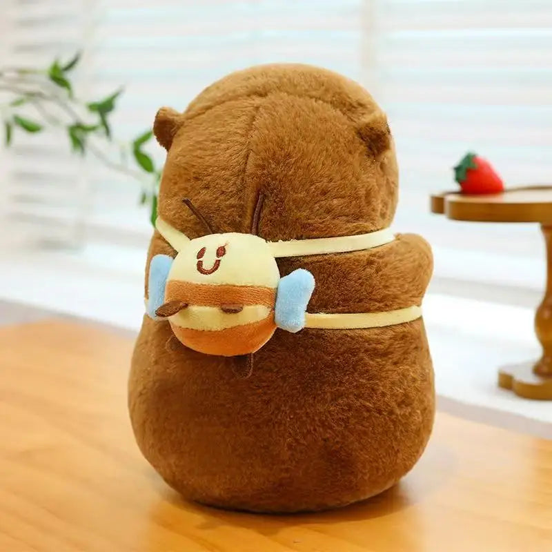 Brown kawaii plush toy with a face on a wooden surface