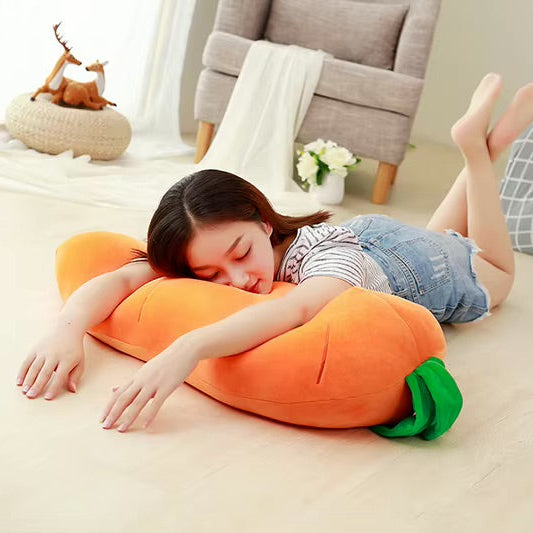 Child lying on a carrot-shaped kawaii pillow in a cozy living room.