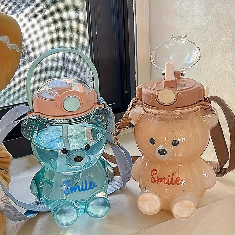 Two bear-shaped kawaii water bottles with 'Smile' text on a surface.