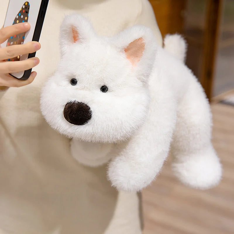 White kawaii plush dog toy held by a person with a blurred background