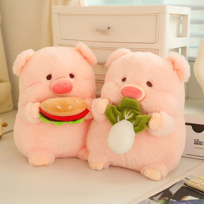 Two pink kawaii plush pigs holding a hamburger and a piece of lettuce on a light-colored surface.