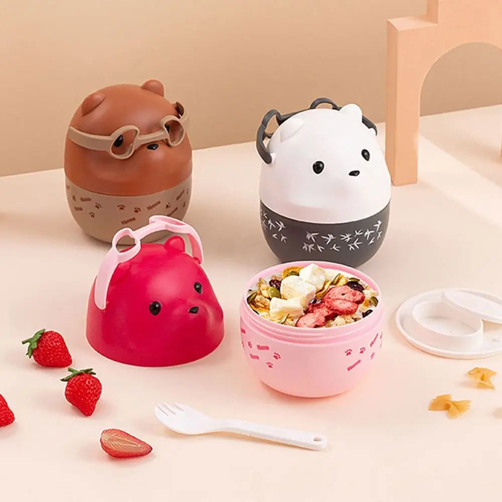Set of cartoon-style kawaii food containers with a pink bowl filled with fruit and a spoon on a light background.